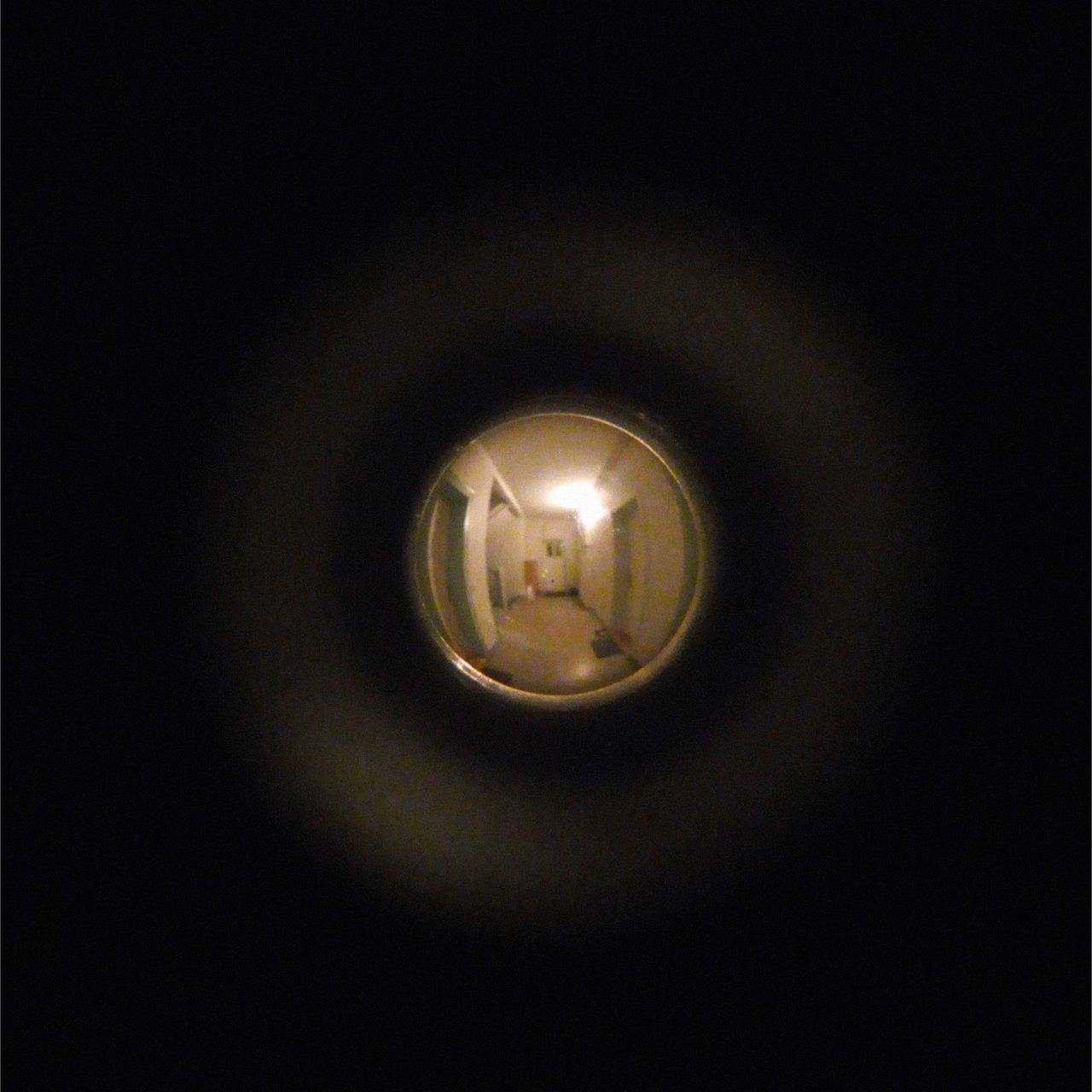 Cover for the album 'gyrare' by REAE. Photograph taken from the peephole of a flat in Dresden, Germany.